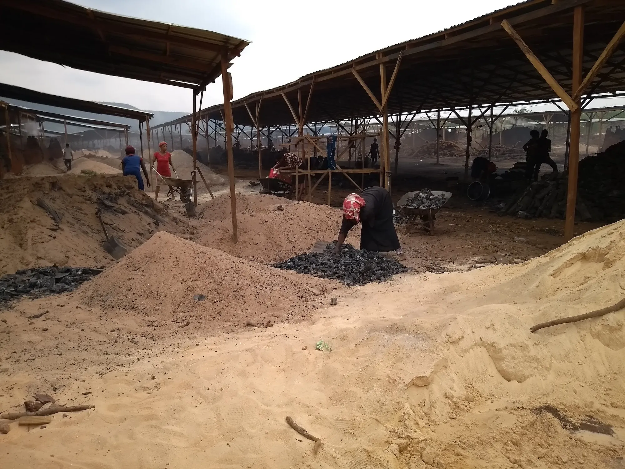 Workers at the Chinese-run charcoal factory in Obimo. Photo: SaharaReporters Media.